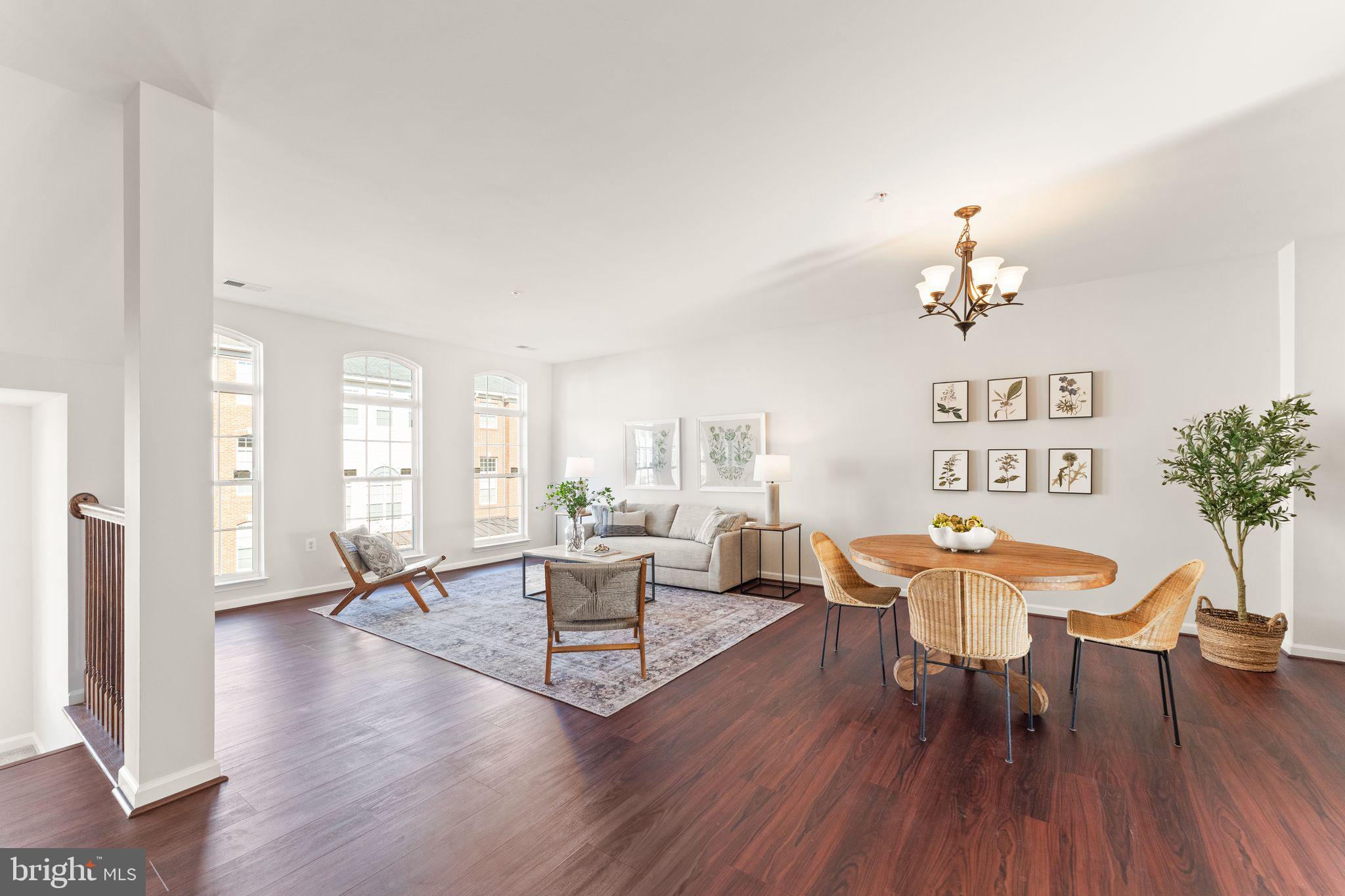 6072 Wicker Lane, Unit 160 Centreville, VA 20121 - Photo 6 of 58 a living room with furniture dining table and a chandelier