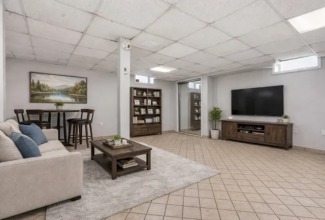 a view of a hallway with wooden shelves