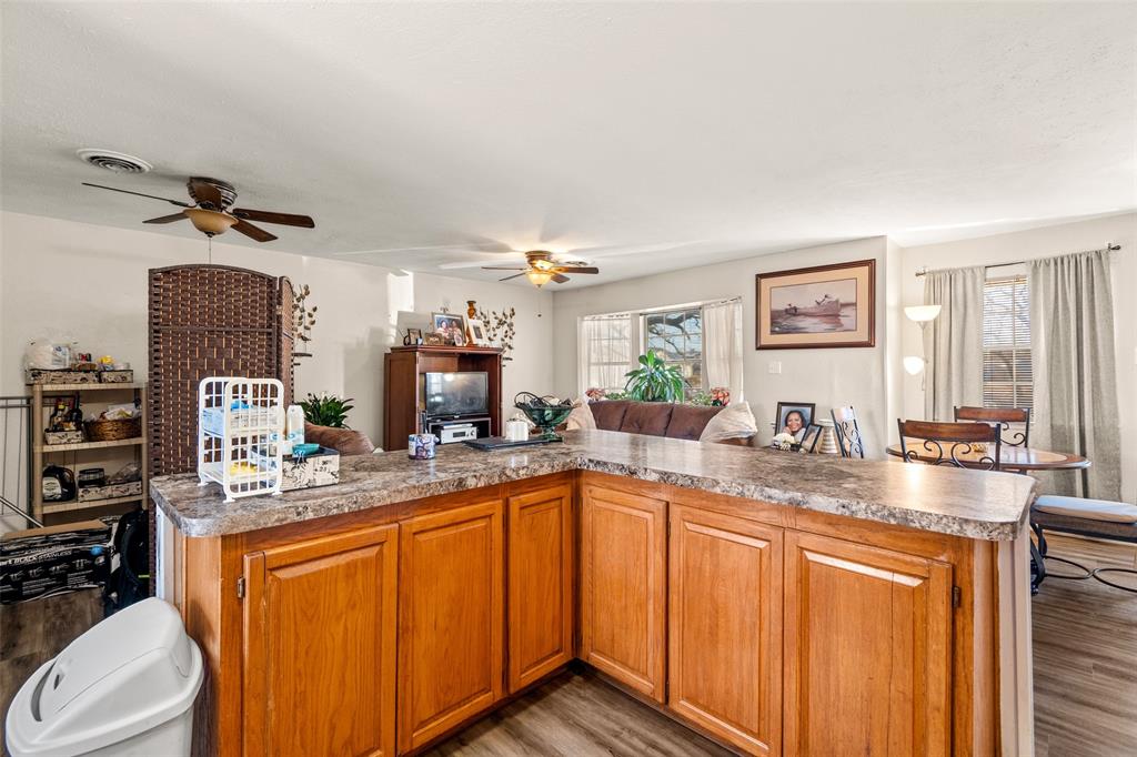 1809 Beverly Street Irving, TX 75061 - Photo 16 of 24 a kitchen with stainless steel appliances granite countertop a sink stove and cabinets
