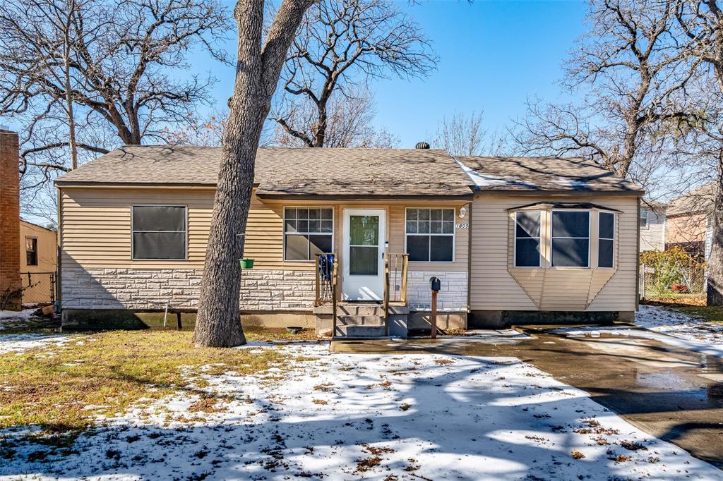 1809 Beverly Street Irving, TX 75061 - Photo 2 of 24 a house with a large tree in front of it