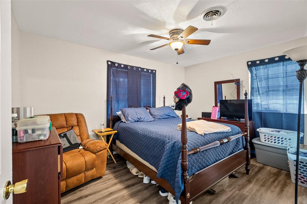 1809 Beverly Street Irving, TX 75061 - Photo 22 of 24 a bed room with bed and window