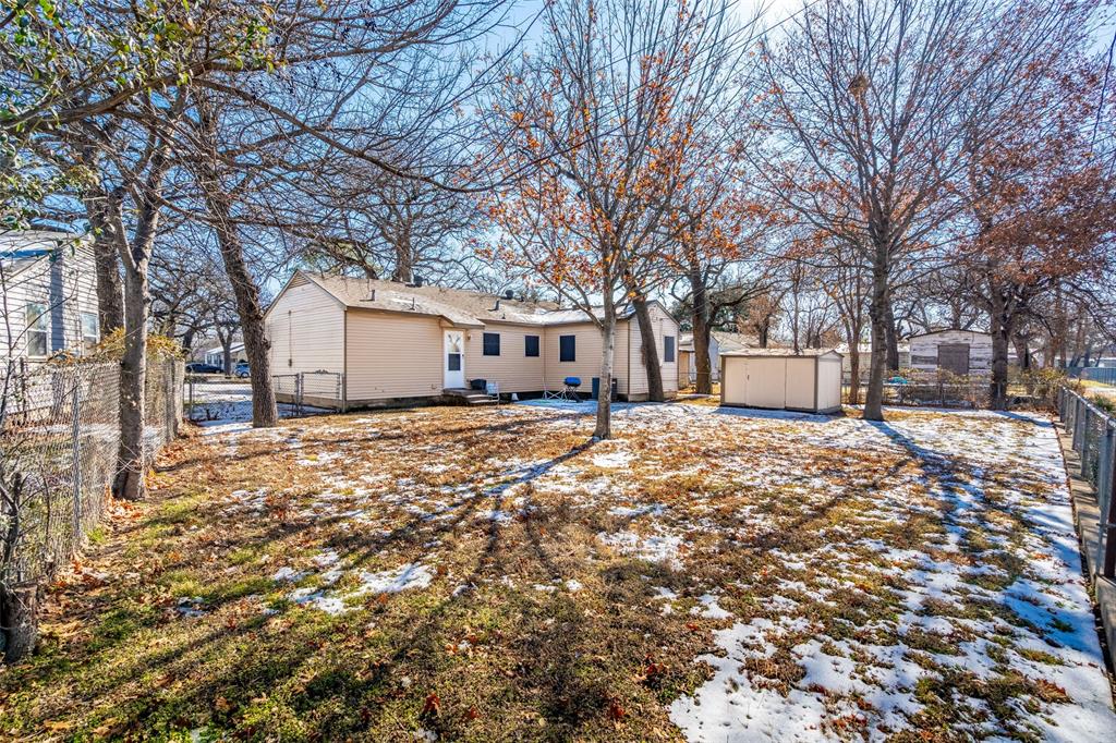 1809 Beverly Street Irving, TX 75061 - Photo 5 of 24 a front view of house with a yard covered in snow