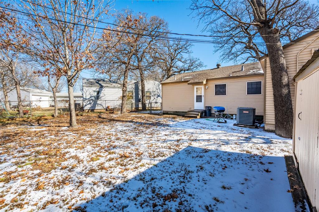 1809 Beverly Street Irving, TX 75061 - Photo 9 of 24 a view of a house with snow on the side of the road