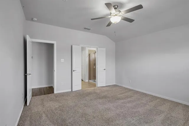 a view of a big room with a ceiling fan and a chandelier fan