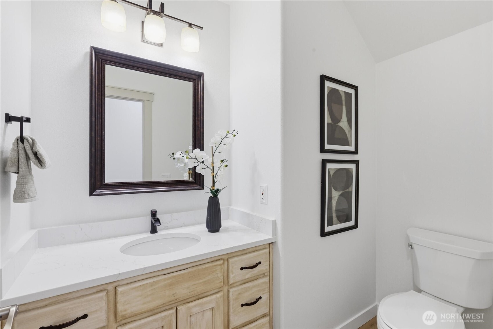 5523 East Wishon Road Snohomish, WA 98290 - Photo 19 of 39 a bathroom with a toilet sink and mirror