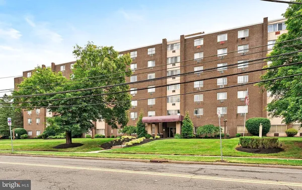 a view of a building with a yard