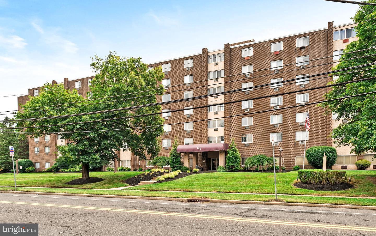 a view of a building with a yard