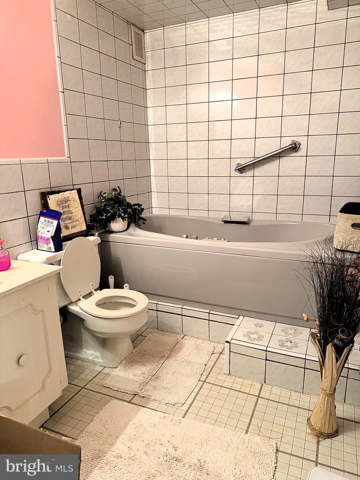 860 Lower Ferry Road, Unit 4C Ewing, NJ 08628 - Photo 12 of 27 a bathroom with a toilet a sink and shower