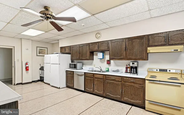 a view of a living room and kitchen