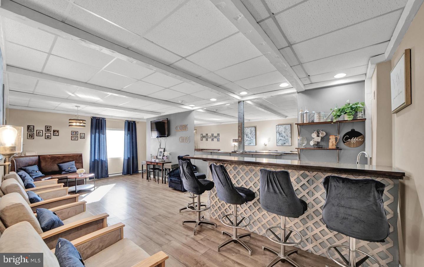 860 Lower Ferry Road, Unit 4C Ewing, NJ 08628 - Photo 26 of 27 a dining hall with stainless steel appliances granite countertop a sink and a granite counter tops with a large window