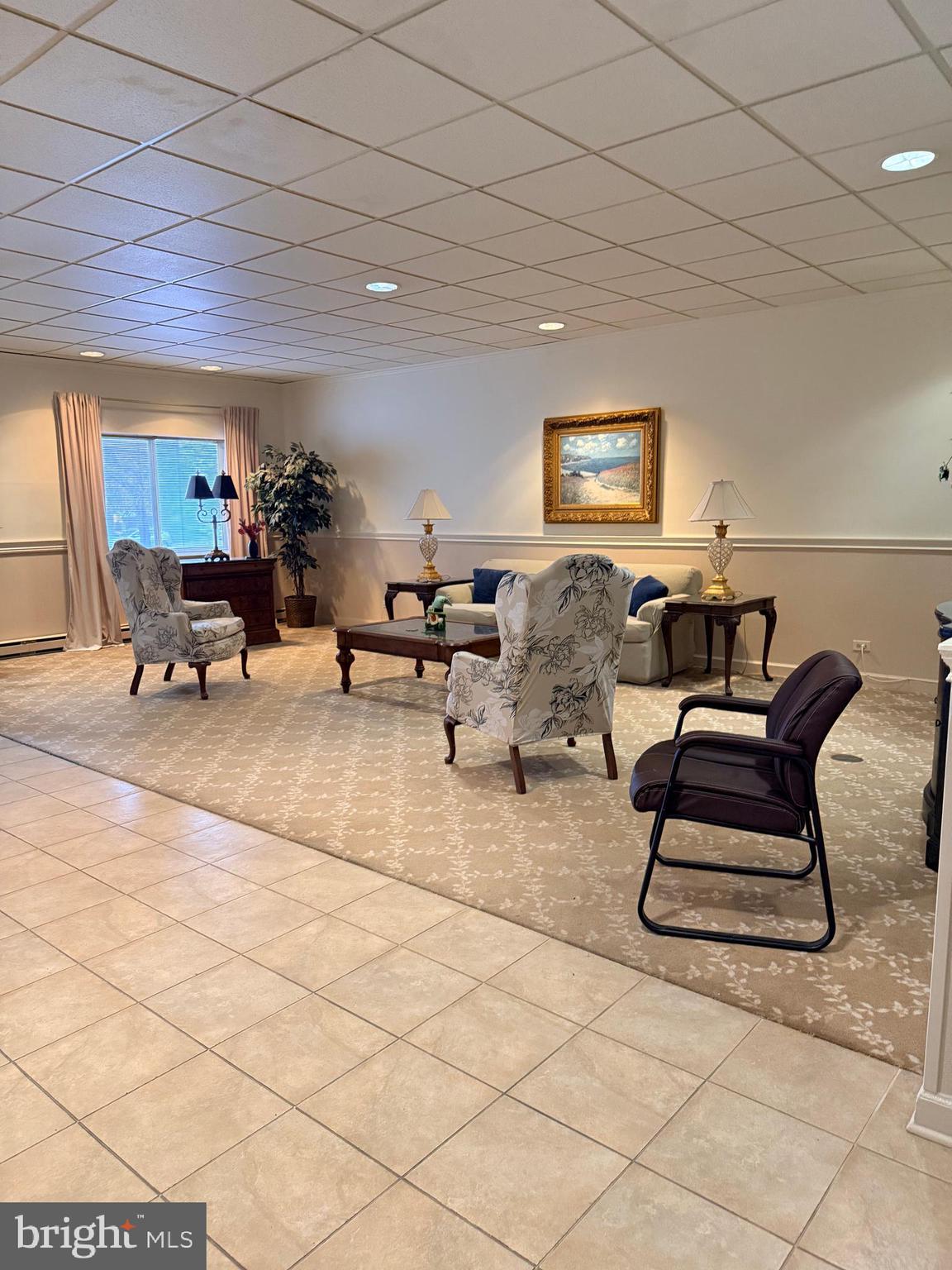860 Lower Ferry Road, Unit 4C Ewing, NJ 08628 - Photo 5 of 27 a living room with furniture and a potted plant