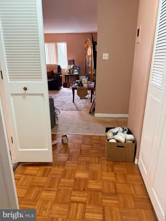 a hallway with a couch and a window