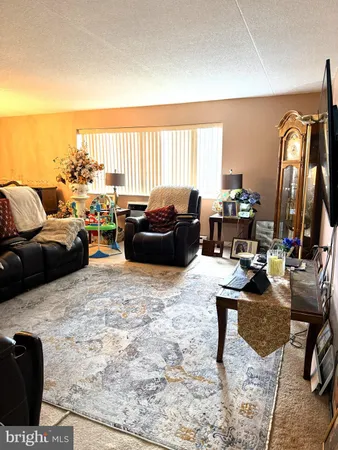 a living room with furniture window and a table