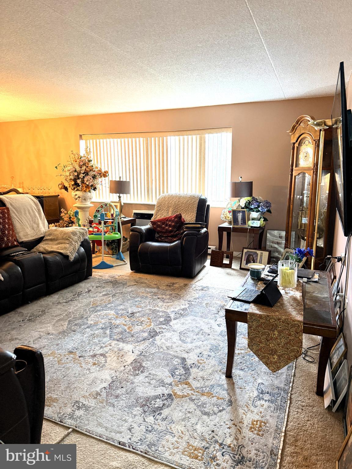 860 Lower Ferry Road, Unit 4C Ewing, NJ 08628 - Photo 10 of 27 a living room with furniture window and a table