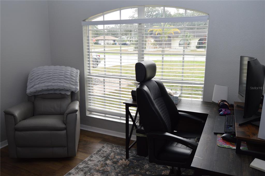 2291 Danforth Road Spring Hill, FL 34608 - Photo 12 of 57 a view of a livingroom with workspace and a window