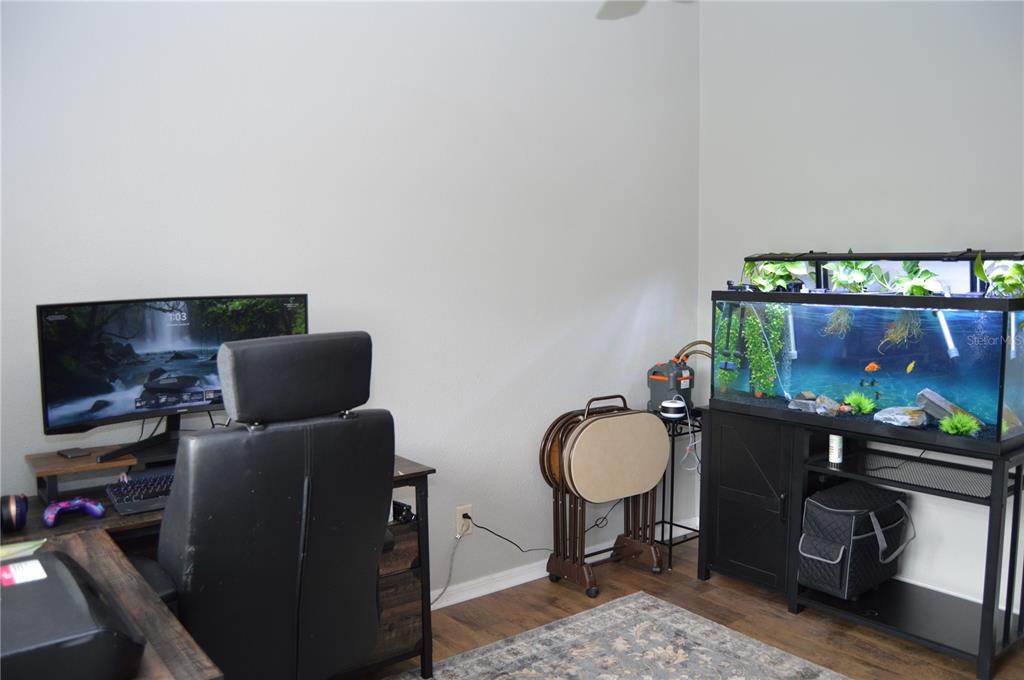2291 Danforth Road Spring Hill, FL 34608 - Photo 13 of 57 a living room with furniture and a flat screen tv