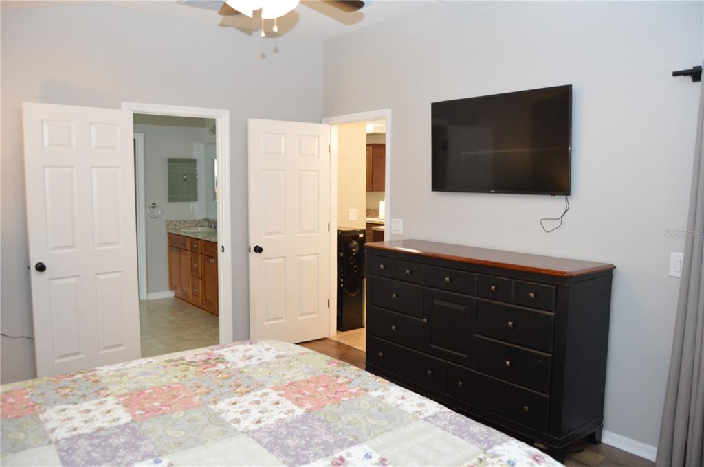 2291 Danforth Road Spring Hill, FL 34608 - Photo 25 of 57 a bedroom with a bed and a flat screen tv