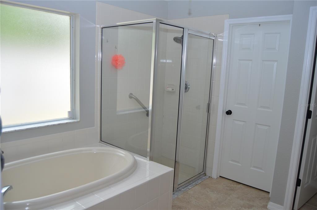 2291 Danforth Road Spring Hill, FL 34608 - Photo 27 of 57 a bathroom with a bathtub and a shower