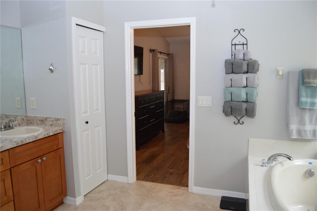 2291 Danforth Road Spring Hill, FL 34608 - Photo 28 of 57 a bathroom with a granite countertop sink and a mirror
