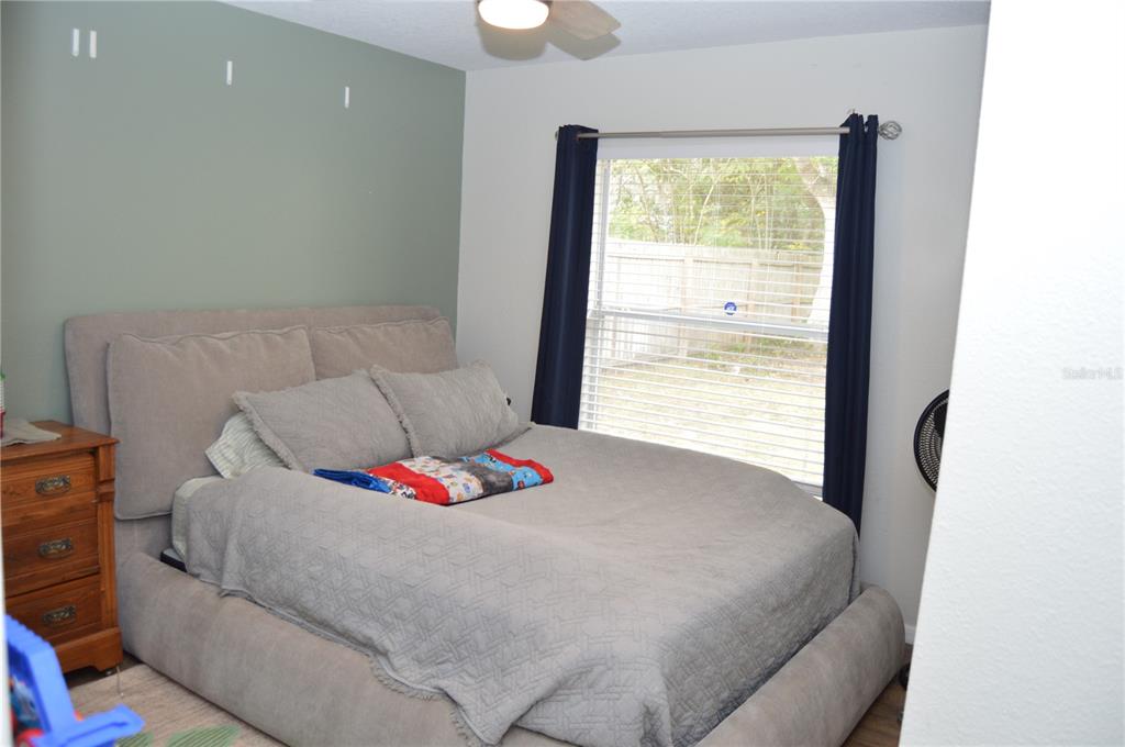 2291 Danforth Road Spring Hill, FL 34608 - Photo 34 of 57 a bedroom with a bed and a window