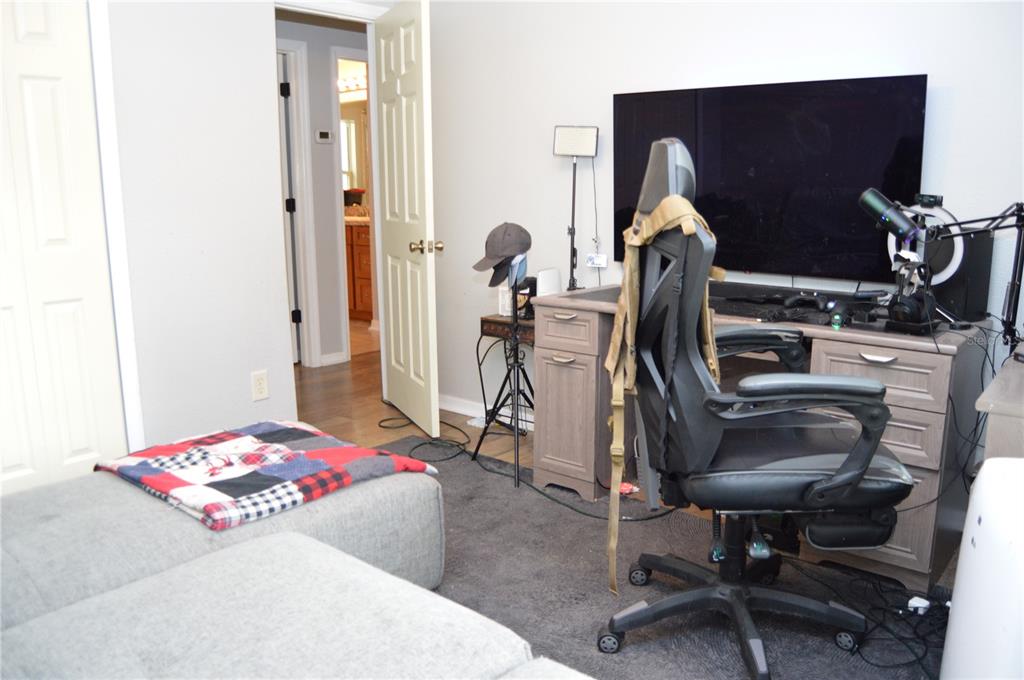 2291 Danforth Road Spring Hill, FL 34608 - Photo 42 of 57 a living room with furniture and a flat screen tv