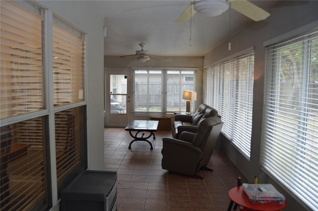 2291 Danforth Road Spring Hill, FL 34608 - Photo 44 of 57 a living room with furniture and a window