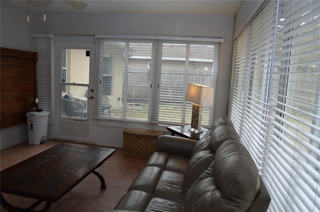 2291 Danforth Road Spring Hill, FL 34608 - Photo 48 of 57 a living room with furniture and a flat screen tv