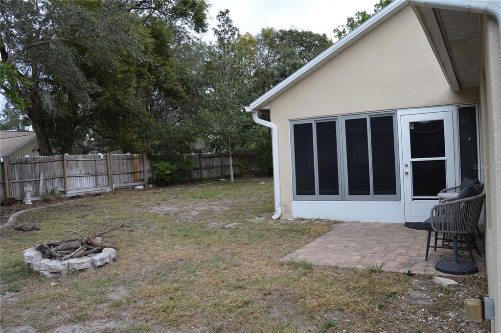 2291 Danforth Road Spring Hill, FL 34608 - Photo 51 of 57 a backyard of a house with barbeque oven