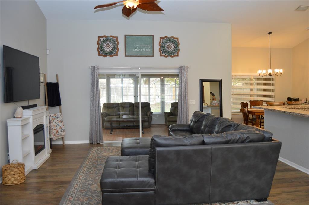 2291 Danforth Road Spring Hill, FL 34608 - Photo 7 of 57 a living room with furniture and a flat screen tv