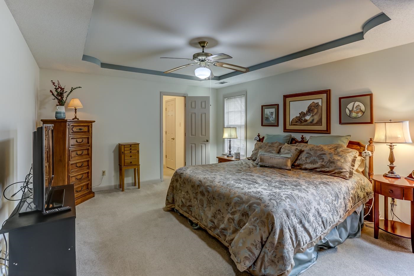 6552 Stephan Ridge Cove Bartlett, TN 38135 - Photo 13 of 24 a spacious bedroom with a bed and a chandelier