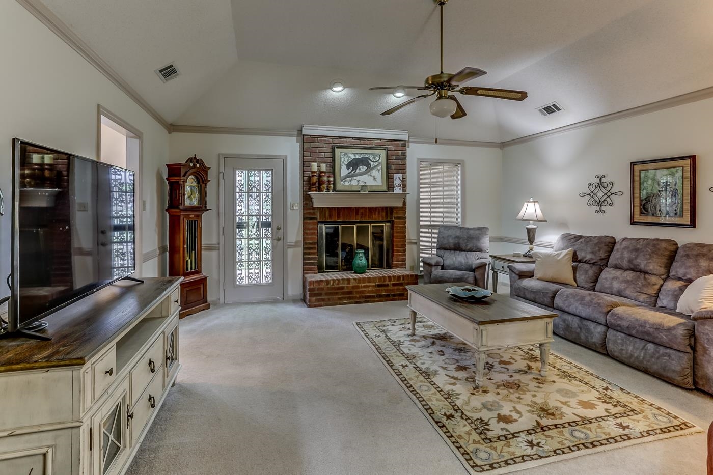 6552 Stephan Ridge Cove Bartlett, TN 38135 - Photo 4 of 24 a living room with furniture flat screen tv and a fireplace