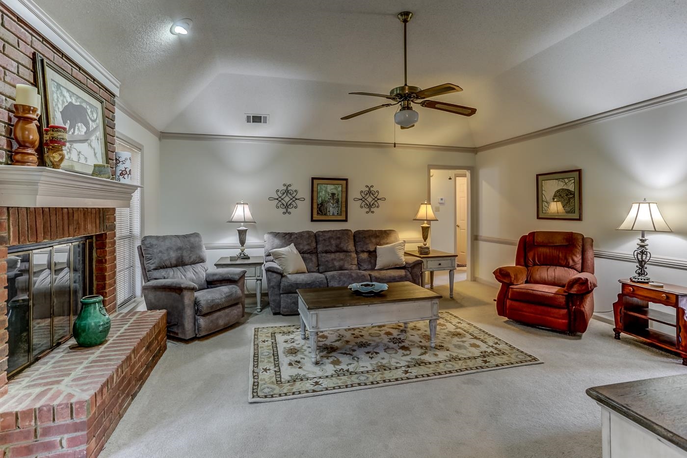 6552 Stephan Ridge Cove Bartlett, TN 38135 - Photo 5 of 24 a living room with furniture a fireplace and a chandelier