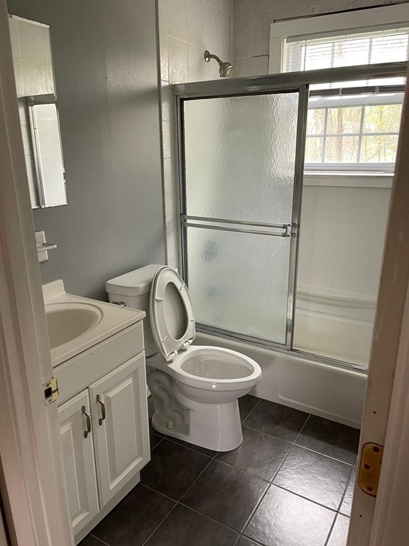148 Boston Post Road East, Unit 10 Marlborough, MA 01752 - Photo 3 of 10 a bathroom with a toilet sink and a shower