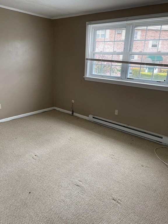 148 Boston Post Road East, Unit 10 Marlborough, MA 01752 - Photo 4 of 10 an empty room with a windows