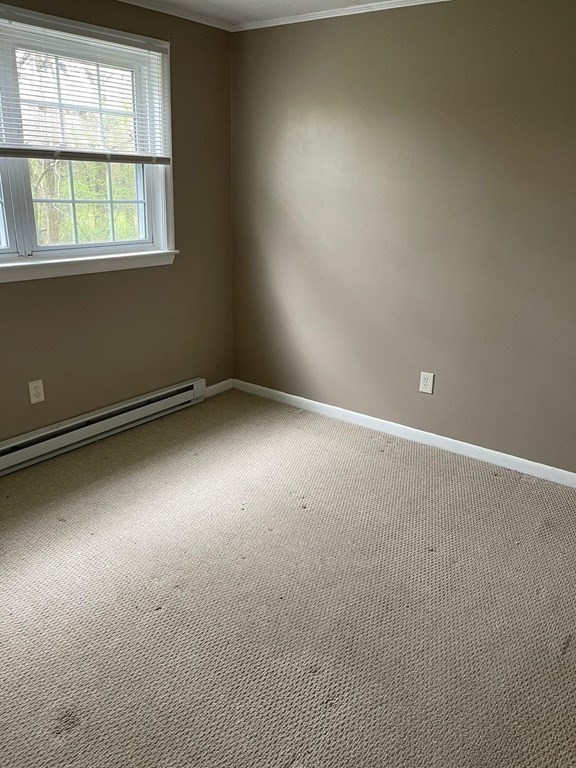 148 Boston Post Road East, Unit 10 Marlborough, MA 01752 - Photo 5 of 10 an empty room with a empty space and windows