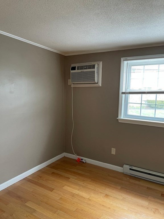 148 Boston Post Road East, Unit 10 Marlborough, MA 01752 - Photo 6 of 10 a view of empty room with wooden floor