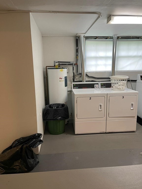 148 Boston Post Road East, Unit 10 Marlborough, MA 01752 - Photo 9 of 10 a kitchen with a stove and a refrigerator