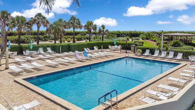 a view of a swimming pool with a patio