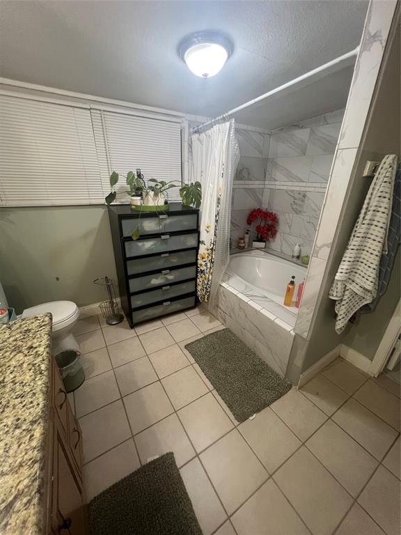 3424 Cardinal Lane Irving, TX 75062 - Photo 11 of 17 a bathroom with a sink and a shower