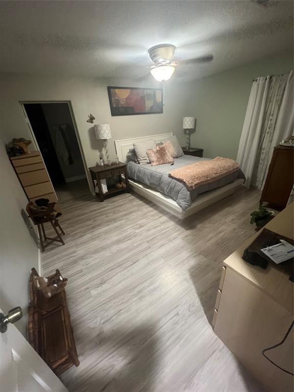 3424 Cardinal Lane Irving, TX 75062 - Photo 15 of 17 a bedroom with a bed and wooden floor