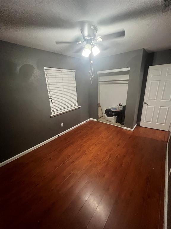 3424 Cardinal Lane Irving, TX 75062 - Photo 17 of 17 a bedroom with a large bed and a chandelier
