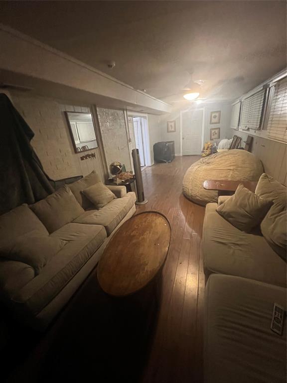 3424 Cardinal Lane Irving, TX 75062 - Photo 6 of 17 a living room with furniture and a chandelier