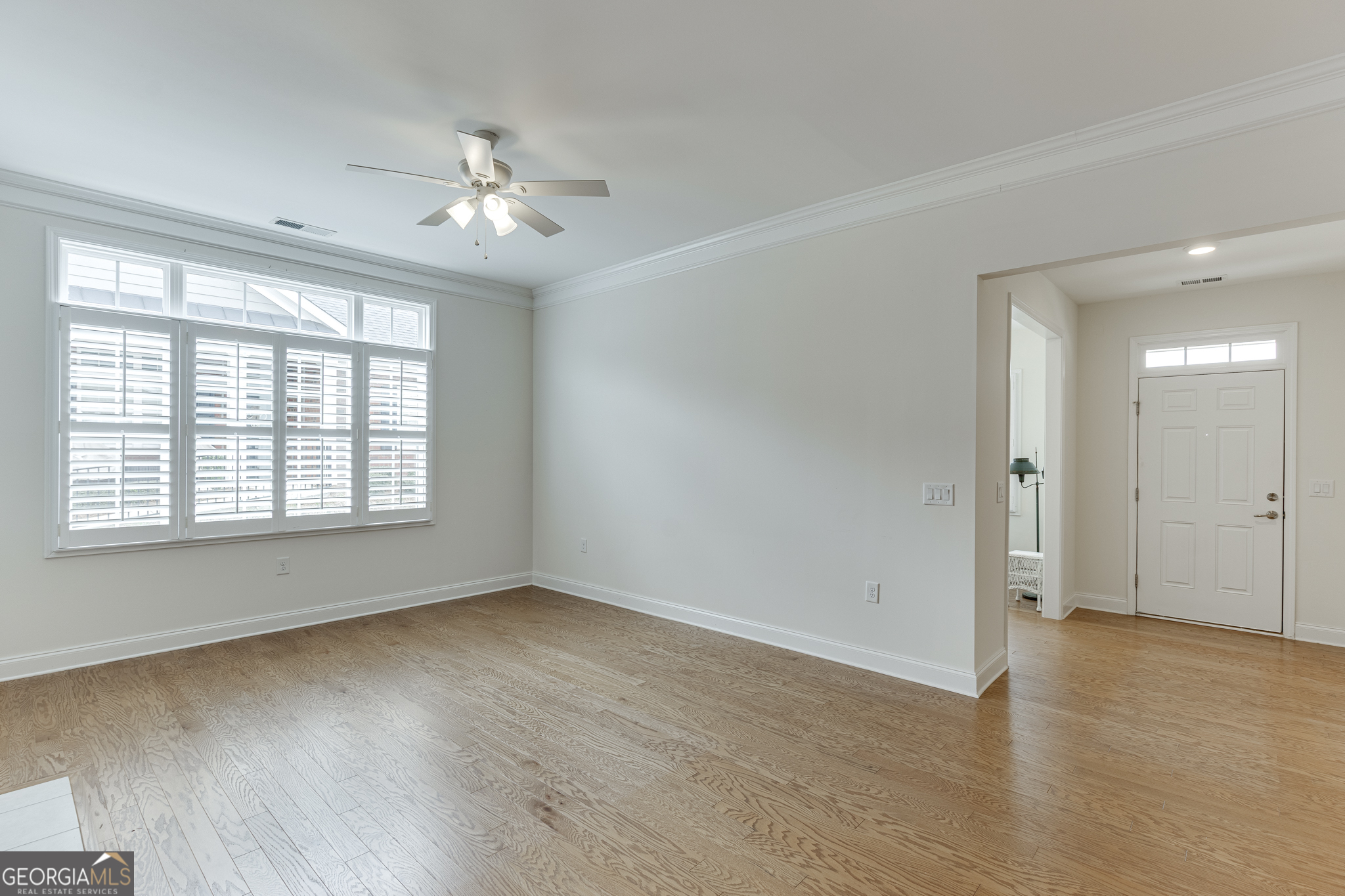 3765 Ridgehurst Drive Buford, GA 30518 - Photo 11 of 44 Bright living room with large windows and open layout.