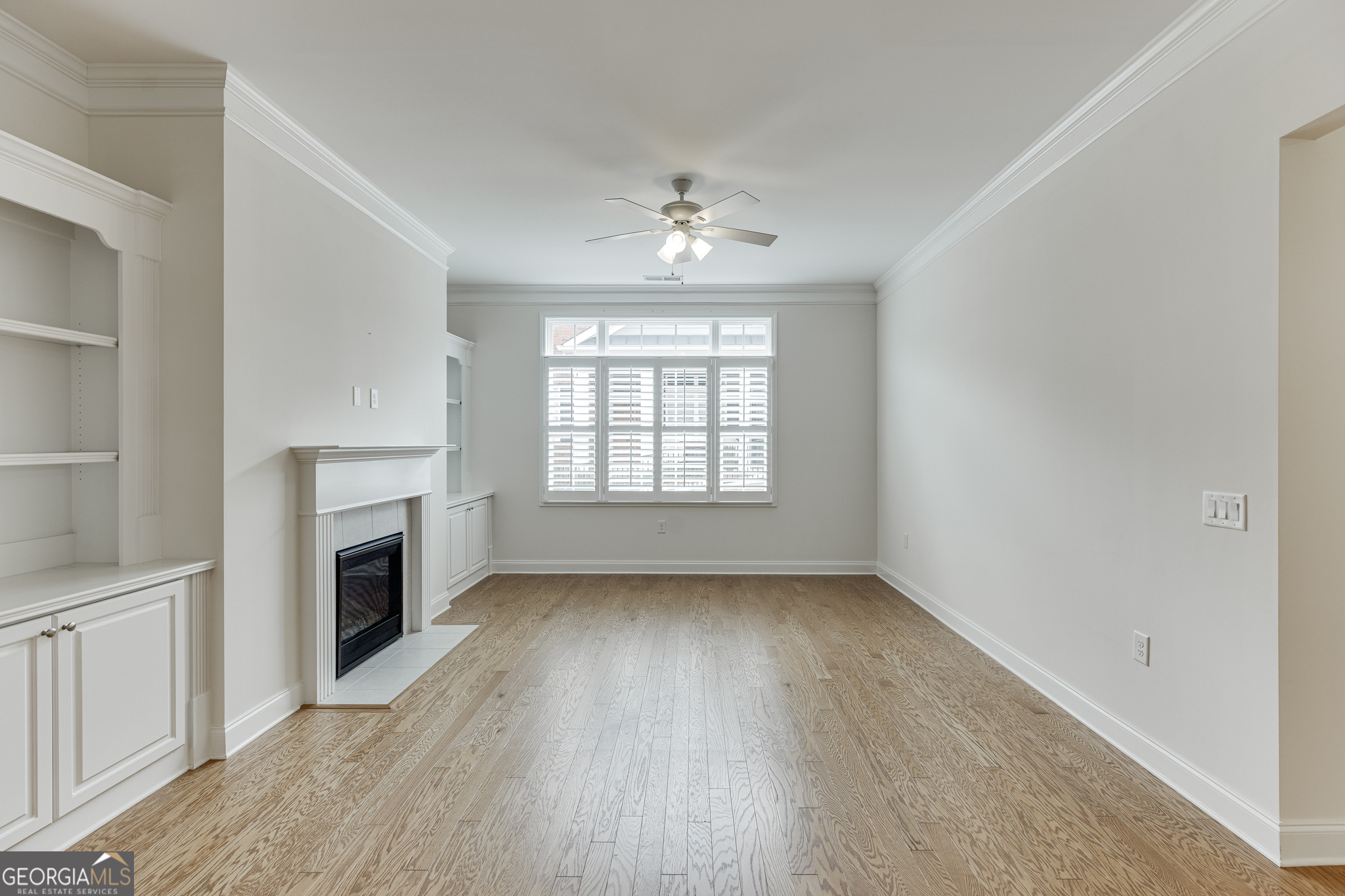 3765 Ridgehurst Drive Buford, GA 30518 - Photo 12 of 44 Additional family room view with fireplace and built-in cabinetry