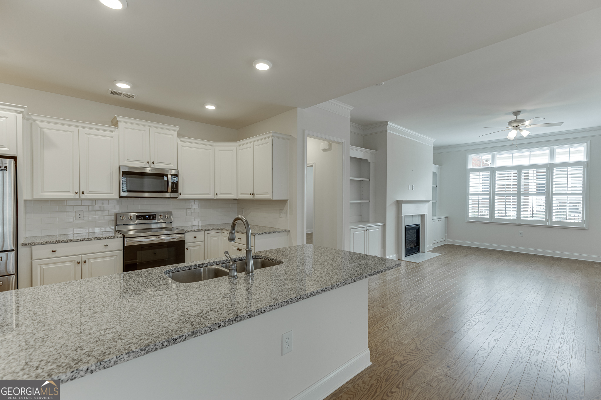 3765 Ridgehurst Drive Buford, GA 30518 - Photo 15 of 44 Open-concept kitchen overlooking the living area for easy entertaining.