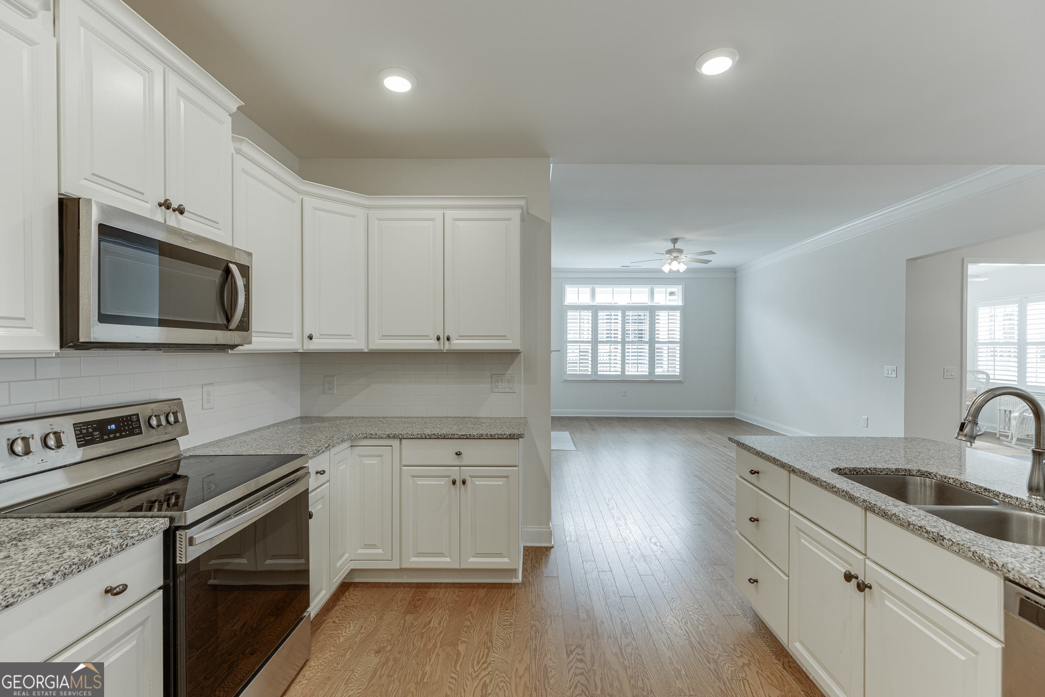 3765 Ridgehurst Drive Buford, GA 30518 - Photo 17 of 44 Spacious kitchen layout with granite counters and hardwood floors.