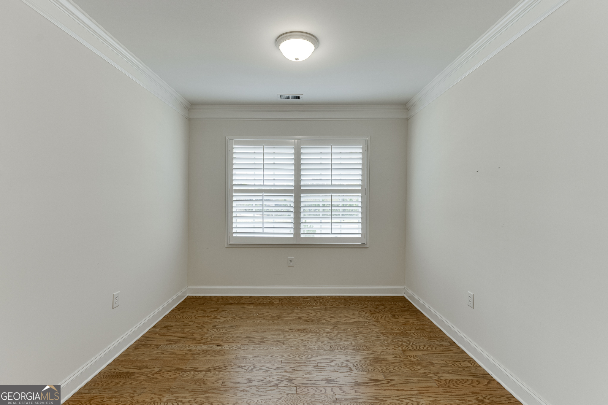 3765 Ridgehurst Drive Buford, GA 30518 - Photo 19 of 44 Formal dining room with hardwood flooring and natural light.