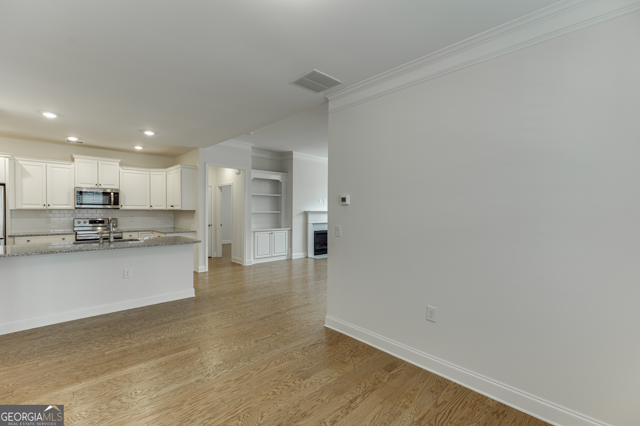 3765 Ridgehurst Drive Buford, GA 30518 - Photo 20 of 44 Dining area opening conveniently to the kitchen and main living spaces.
