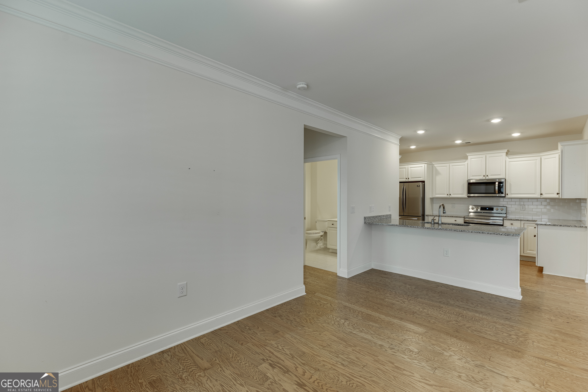 3765 Ridgehurst Drive Buford, GA 30518 - Photo 21 of 44 Additional dining room view showing open flow and flexible use.