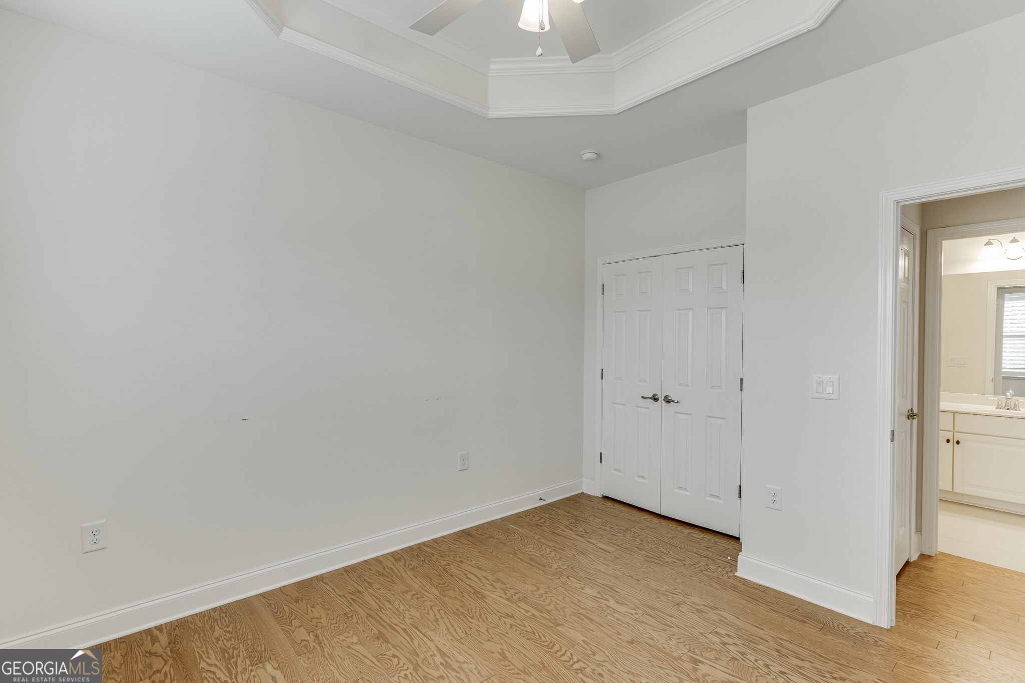 3765 Ridgehurst Drive Buford, GA 30518 - Photo 23 of 44 Secondary bedroom with tray ceiling and generous layout.